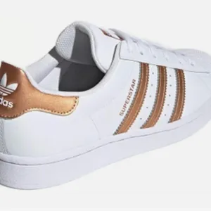 adidas Superstar White and Gold Athletic Shoes