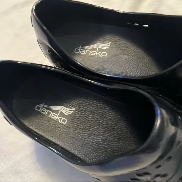 Dansko Women's Black Floral side holes breathable Clogs