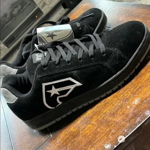 DC Famous Black and White Suede Sneakers