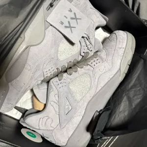 Gray Suede Sneakers Nike Jordan. Retro 4 kaws