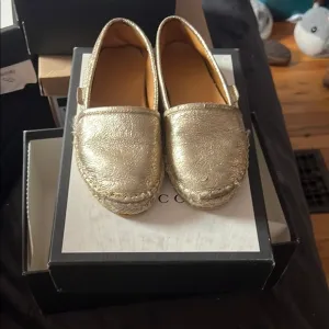 Gucci Gold Moccasins Elegant Casual Footwear