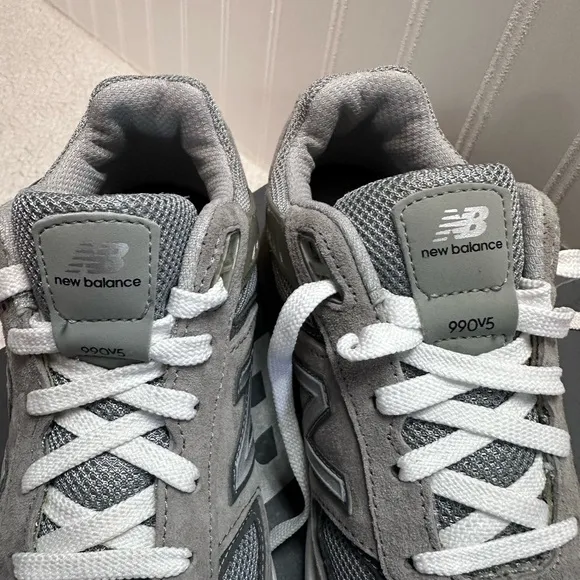 New Balance® Kids 990V5 Launch running shoes. Sneaker features a durable size 3
