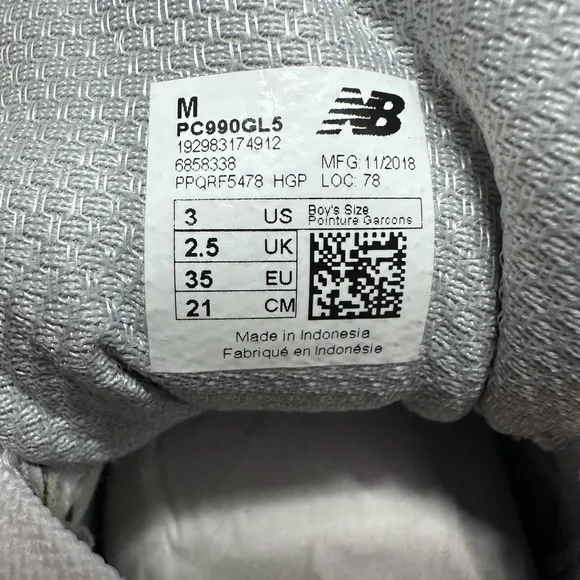New Balance® Kids 990V5 Launch running shoes. Sneaker features a durable size 3