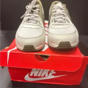 Nike White and Tan Sneakers with Classic Silhouette