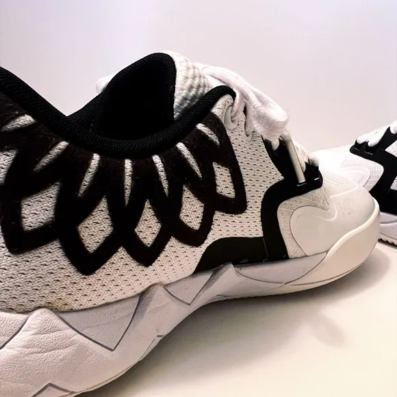 Puma Black and White Sneakers with Breathable Mesh Design