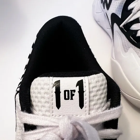 Puma Black and White Sneakers with Breathable Mesh Design