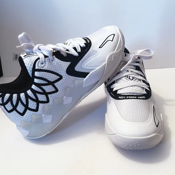 Puma Black and White Sneakers with Breathable Mesh Design