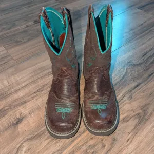 Women's Brown Leather and turquoise stitched Ariat cowgirl boots.