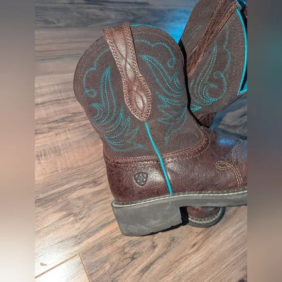 Women's Brown Leather and turquoise stitched Ariat cowgirl boots.
