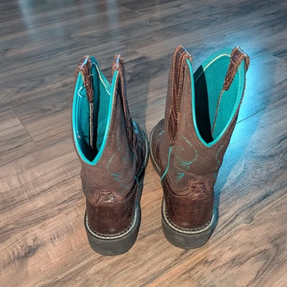 Women's Brown Leather and turquoise stitched Ariat cowgirl boots.